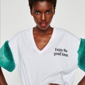 White top with faux fur sleeves